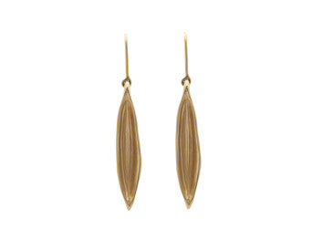Long drop earrings in shape of vanilla bean in solid yellow gold.