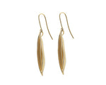 Long drop earrings in shape of vanilla bean in solid yellow gold.