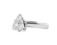 Three diamonds set in triangle, white gold.