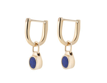 Small round drops with blue lapis inside, yellow gold frame. Drops hang from small U shaped hoops in yellow gold.
