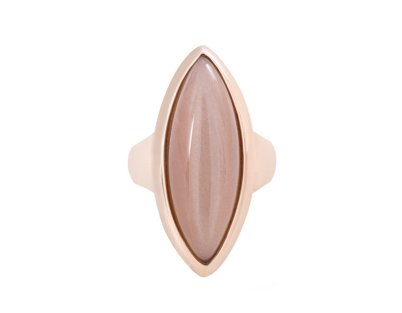 Very long cabochon of salmon pink moonstone coming to point at both ends, set in frame of rose gold.