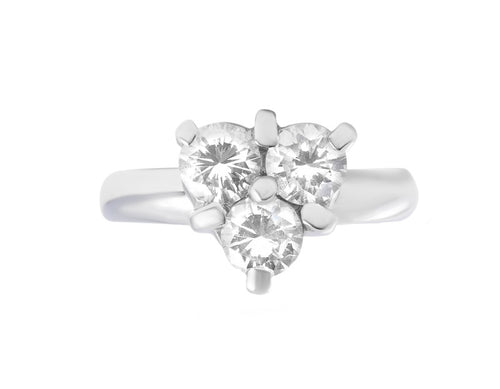 Three diamonds set in triangle, white gold.