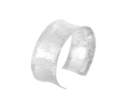 Wide silver wrist cuff, hammered.