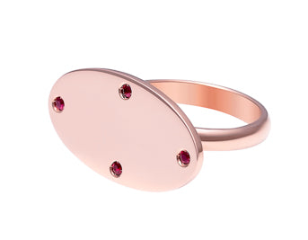 Very large oval signet ring with four small small rubies around edge of face in rose 18k gold.