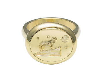Medium oval signet ring in green 18k gold with whimsical wolf engraving..