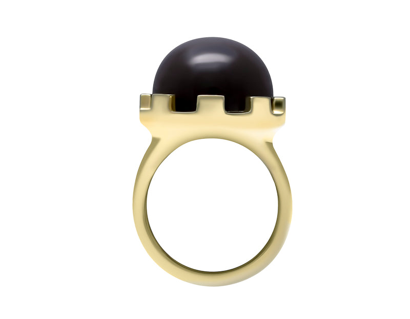 Large green gold ring with cabochon of dark grey moonstone set in interesting frame.