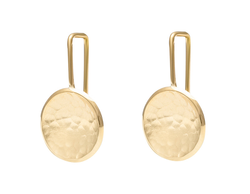 Round drop earrings in yellow gold with hammered texture in bowl on shepherd's hooks.