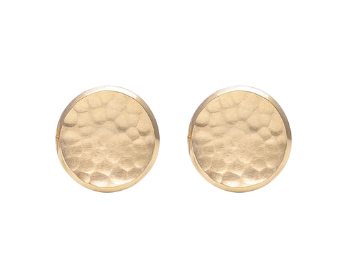 Round stud earrings in yellow gold with hammered texture in bowl.