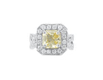 Yellow sapphire ring, platinum, surrounded by diamonds.