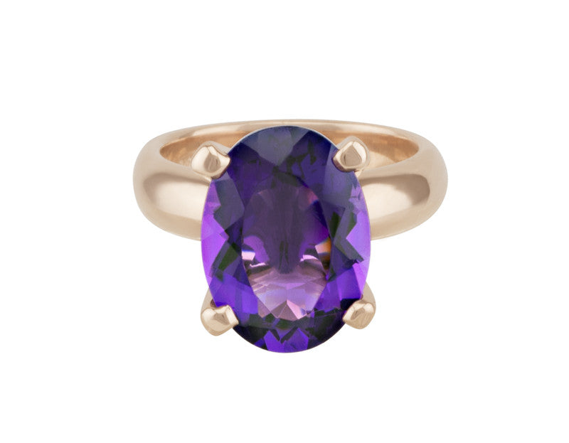 Ring with oval amethyst prong set, rose gold.