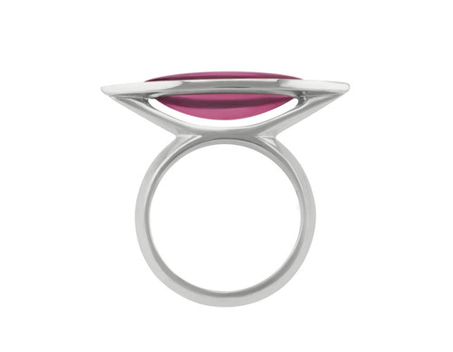 Long cabochon of rich pink tourmaline coming to point at both ends, set in frame of 18 karat white gold with two accent diamonds in frame.