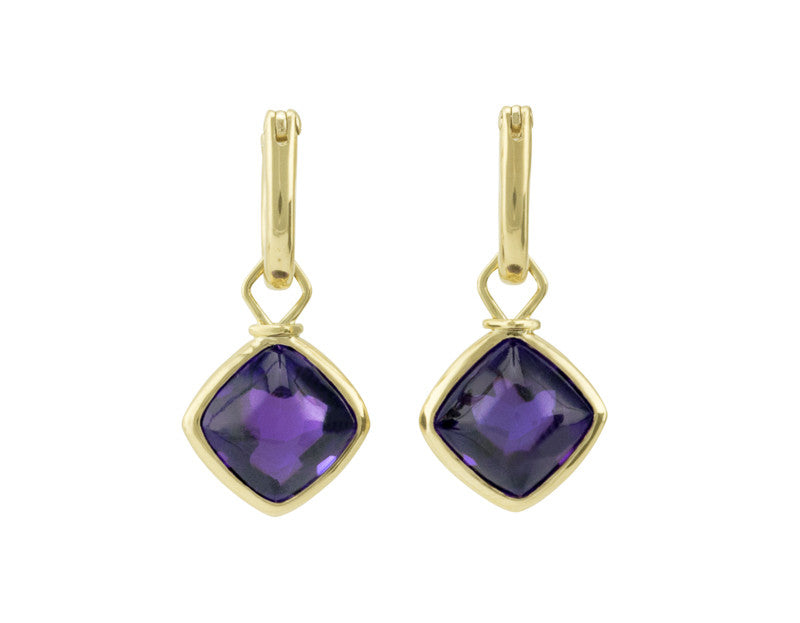 Diamond shaped drops with bright purple cabochon gems in green gold frame. Drops hang on small U shaped hoops in solid green gold.