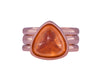 Rose gold ring with a triangle cabochon of bright orange spessartite garnet.  The ring is flanked by two matching rose gold bands.