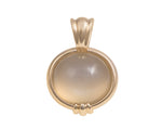 Large oval moonstone pendant in yellow gold.