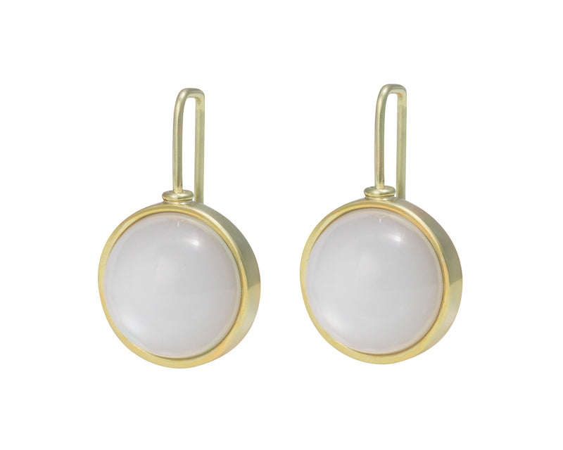 Medium round white moonstone cabochons in green gold frame and shepherd's hooks.