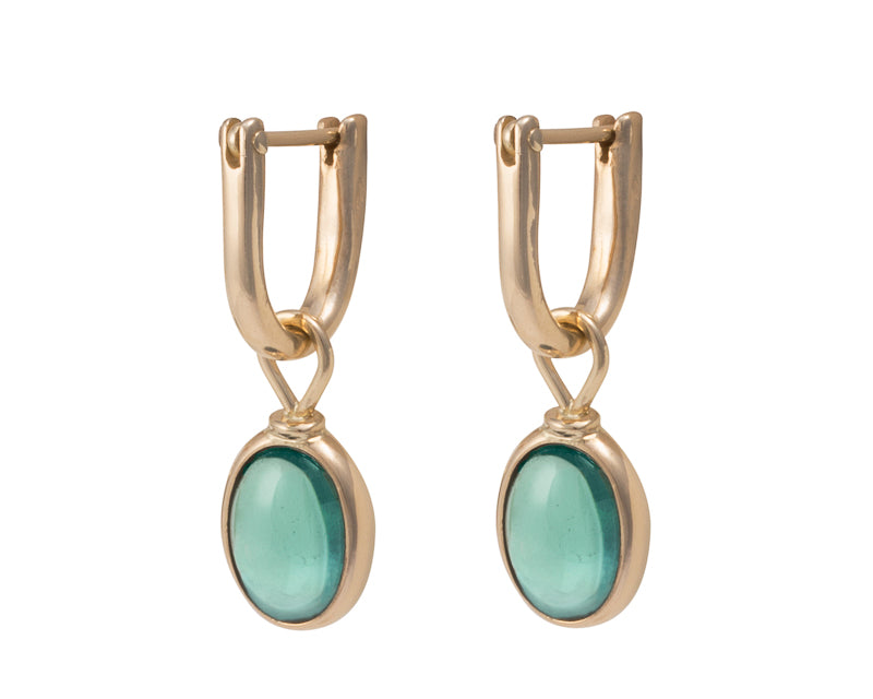 Oval drops with medium green cabochon gem in yellow gold frame. Drops hang on small U shaped hoops in solid yellow gold.