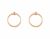 Rose gold hoops hanging on rose gold tiny ball studs.