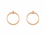Rose gold hoops hanging on rose gold tiny ball studs.