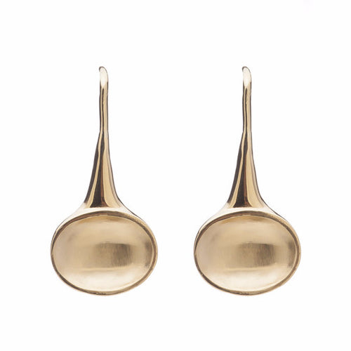 Oval drop earrings in yellow gold with matte finish in bowl, on shepherd's hooks.
