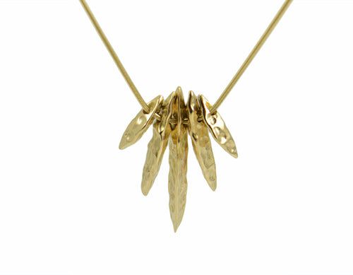 Pendant, solid yellow gold, five separate beads shaped almost like long loaves of bread.