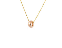 One donut-shaped bead in rose gold on chain.