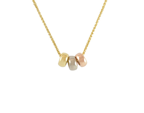 Three donut-shaped beads in rose, white and yellow gold on chain.