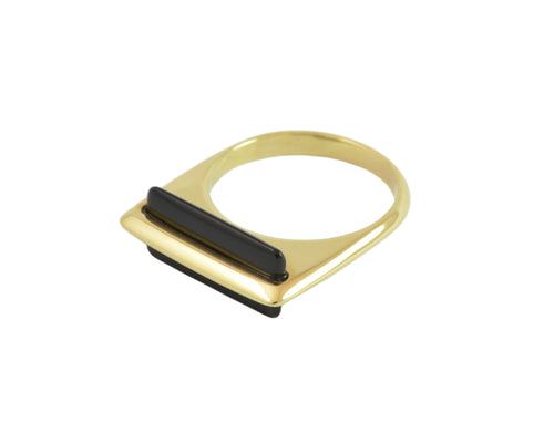 Yellow gold ring, square across top, wafer of onyx set through gold.