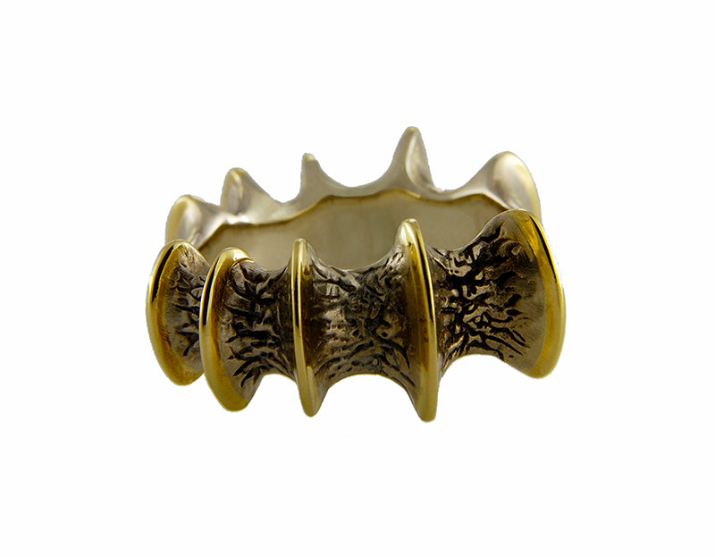 Wide band white and yellow gold, texture like bone.