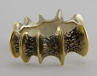 Wide band white and yellow gold, texture like bone.