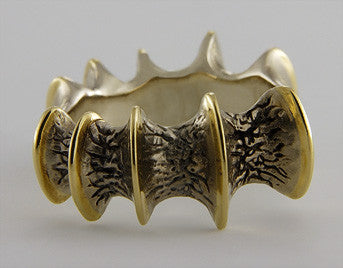 Wide band white and yellow gold, texture like bone.