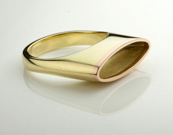 Green gold ring, oval bowl in top, matte finish interior, rose gold rim around top.