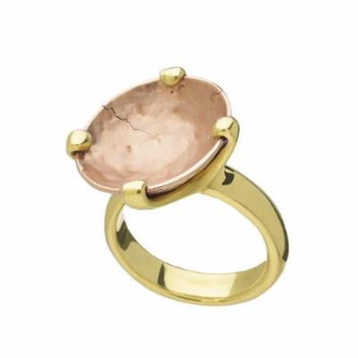 Green gold ring prong set with very large rose gold bowl, hammered texture in bowl.