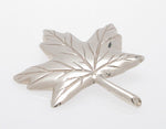 Sterling silver sculpted maple leaf pendant.
