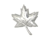 Sterling silver sculpted maple leaf pendant.