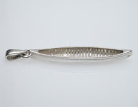 Sterling silver sculpted canoe pendant.