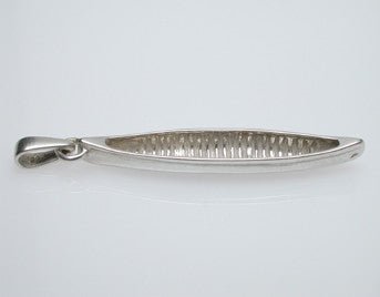 Sterling silver sculpted canoe pendant.