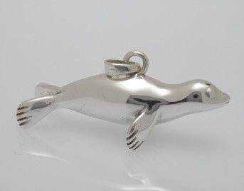 Sterling silver sculpted harp seal pendant.