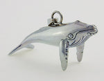 Sterling silver sculpted humpbacked whale pendant.