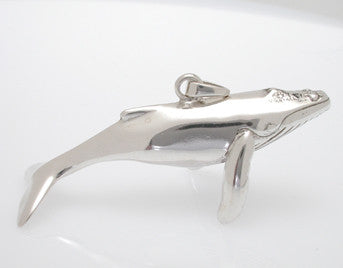 Sterling silver sculpted humpback whale pendant.