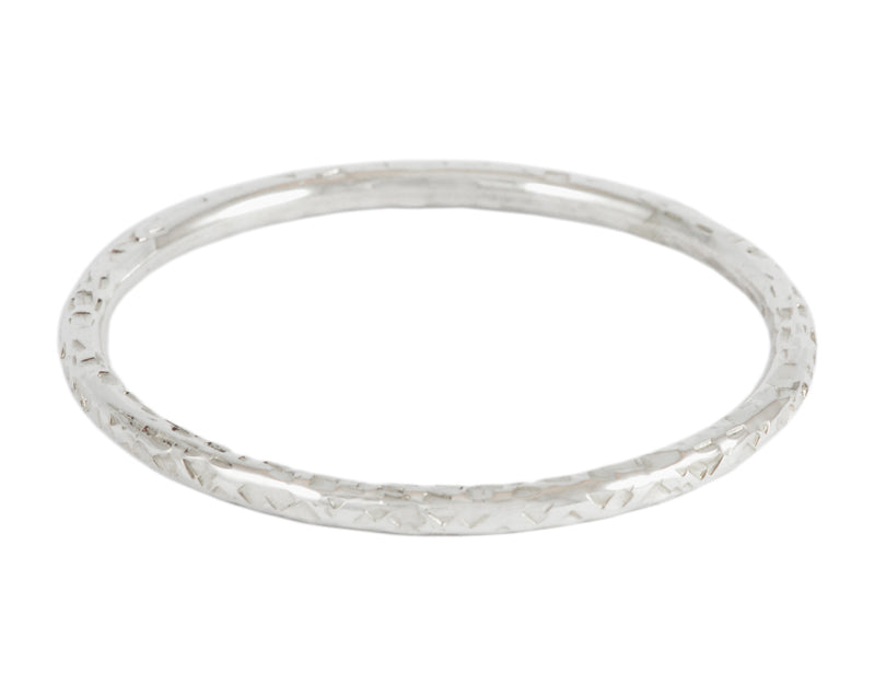 Silver bangle, round wire, hammered.