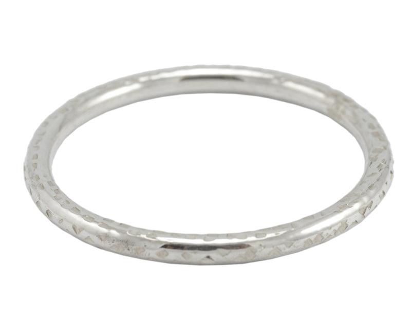 Silver bangle, round wire, hammered.