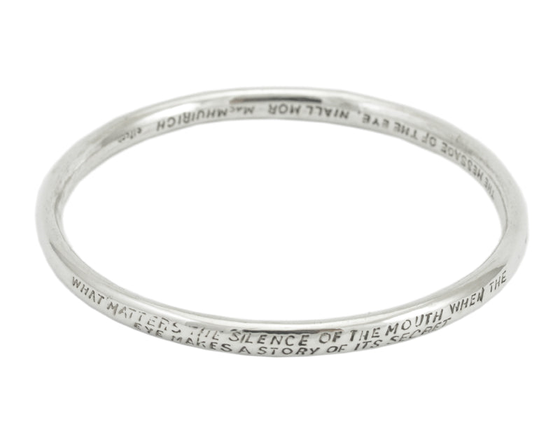 Silver bangle, round wire, with engraved text.
