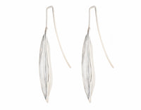 Very long silver drop earrings in the shape of vanilla beans.
