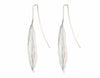 Very long silver drop earrings in the shape of vanilla beans.