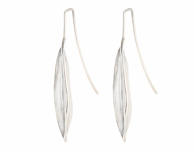 Very long silver drop earrings in the shape of vanilla beans.