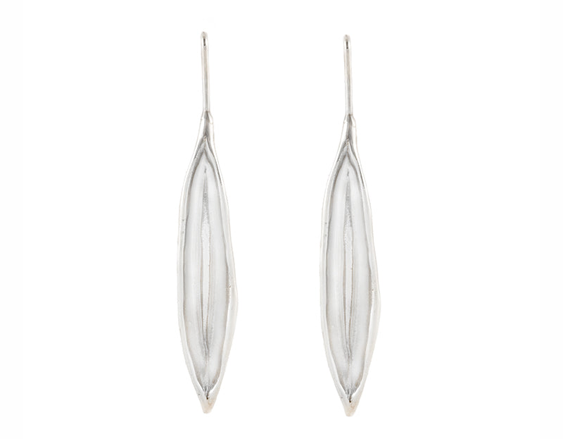Very long silver drop earrings in the shape of vanilla beans.
