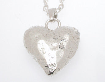Sterling silver sculpted large heart pendant.