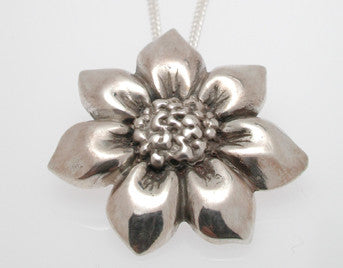 Sterling silver sculpted sunflower pendant.