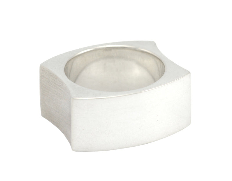 Wide silver band. Concave sides.