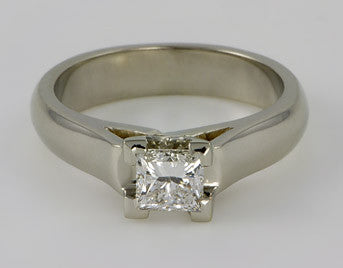 White gold ring with square diamond.